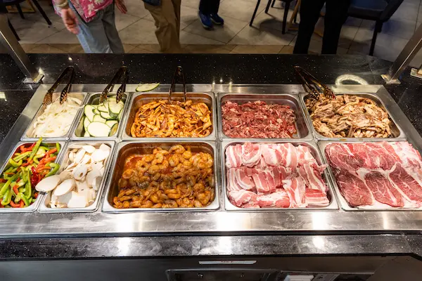 Grill Station with Sliced Meats and Vegetables